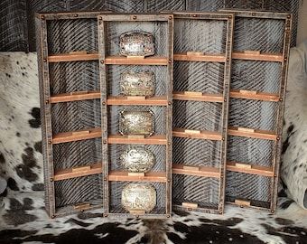 a cow hide with several bowls and plates in it's display case on the floor