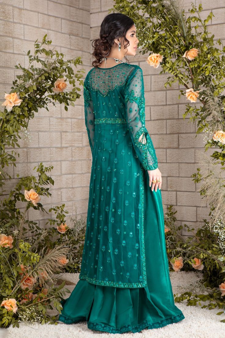 Emerald hued net front-open heavily embroidered jacket featuring glistening sequins, beads, pearls, crystals, stones and silk thread embroidery, attached to pure raw silk pleated gown, paired with heavily sequins embellished net dupatta, a wardrobe must have this wedding season. Gown Fabric: Net & Pure Raw Silk Length: Jacket length 48”, Gown Length 58” (customisable mention in order notes) Dupatta Fabric: Net Color: Emerald Green This is a two-piece outfit including gown & Draped dupatta. All o Semi-stitched Front Open Anarkali Set With Dupatta, Anarkali Dupatta With Resham Embroidery, Anarkali Dupatta With Resham Embroidery And Front Open, Designer Semi-stitched Front Open Anarkali Set, Front Open Georgette Anarkali Set With Zari Work, Anarkali Style Front Open Georgette Dupatta, Designer Resham Embroidered Front-open Anarkali Set, Elegant Front Open Anarkali Set In Georgette, Elegant Front Open Georgette Anarkali Set