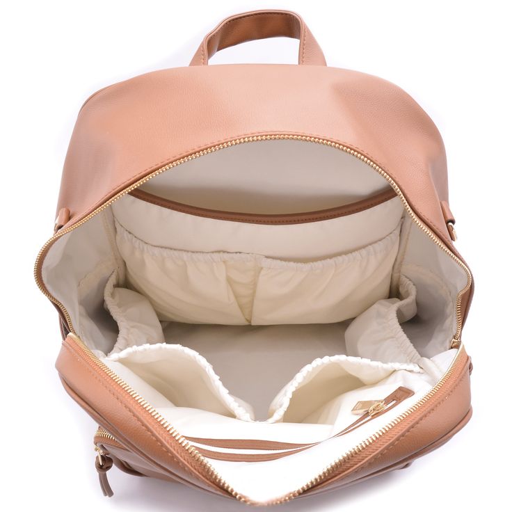 This stylish and functional backpack is crafted from premium vegan leather, offering a chic yet practical solution for parents on the go. Its spacious interior can easily accommodate all your baby essentials, including a large compartment for a laptop, making it an ideal choice for modern, busy lifestyles. This vegan leather bag is not only fashionable but also durable, ensuring it can keep up with your daily demands. Perfect for those seeking a convenient and large diaper bag that doesn't compr Functional Leather Diaper Bag With Removable Pouch, Leather Backpack Diaper Bag For On-the-go, Leather Diaper Backpack For On-the-go, Functional Leather Diaper Bag For Daily Use, Modern Diaper Bag Backpack With Zipper, Travel Backpack With Zipper Pocket In Faux Leather, Modern Leather Backpack Diaper Bag, Leather Diaper Bag Backpack With Removable Pouch, Modern Leather Diaper Bag Backpack