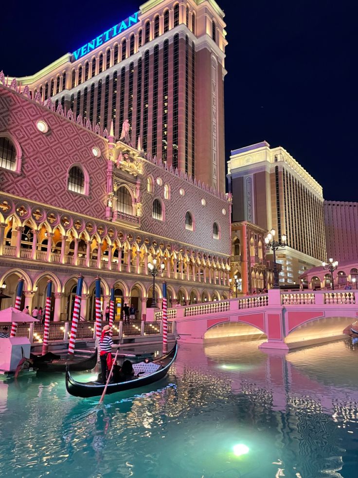 a gondola in front of the las vegas strip hotel and casino at night