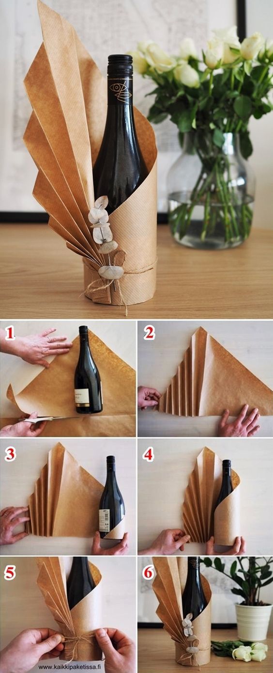 how to make a wine bottle origami vase with flowers in it and instructions on how to fold the paper