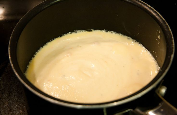 a pan filled with food sitting on top of a stove