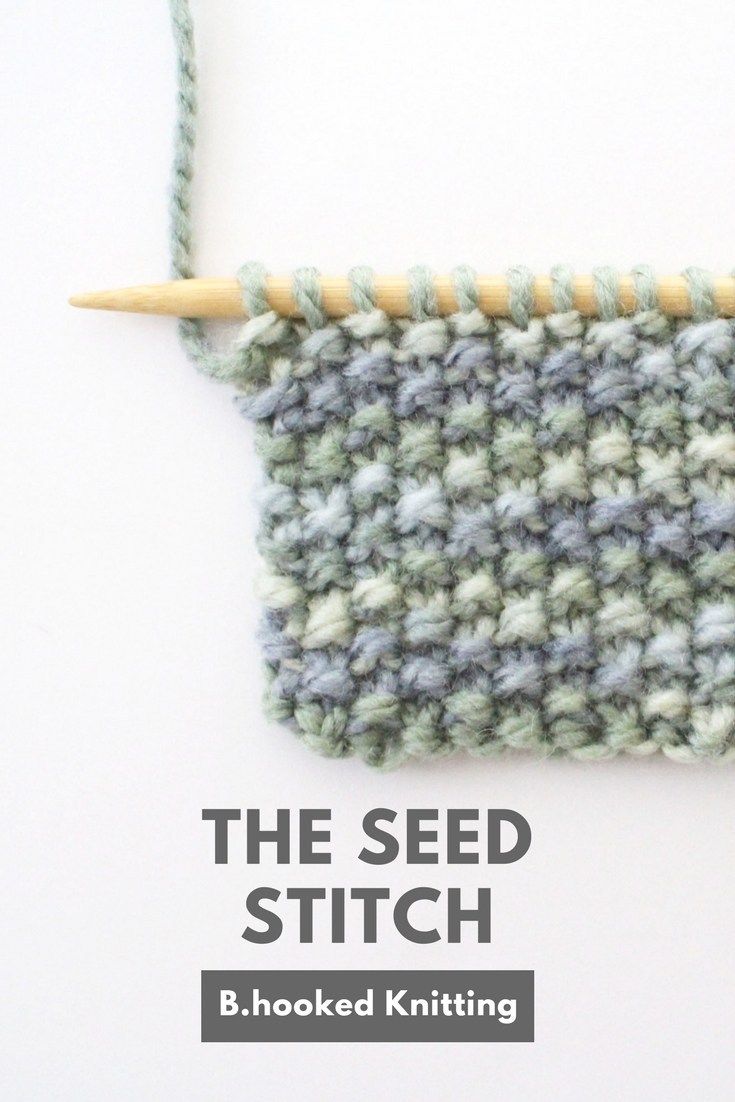 the seed stitch is hooked up with a wooden knitting needle to make it look like yarn