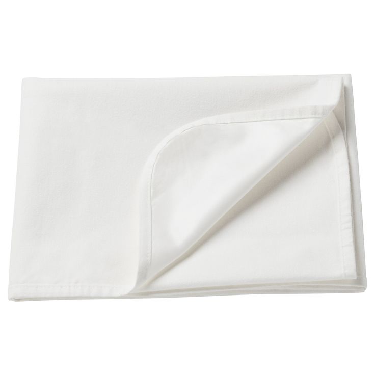 a white sheet folded on top of a bed