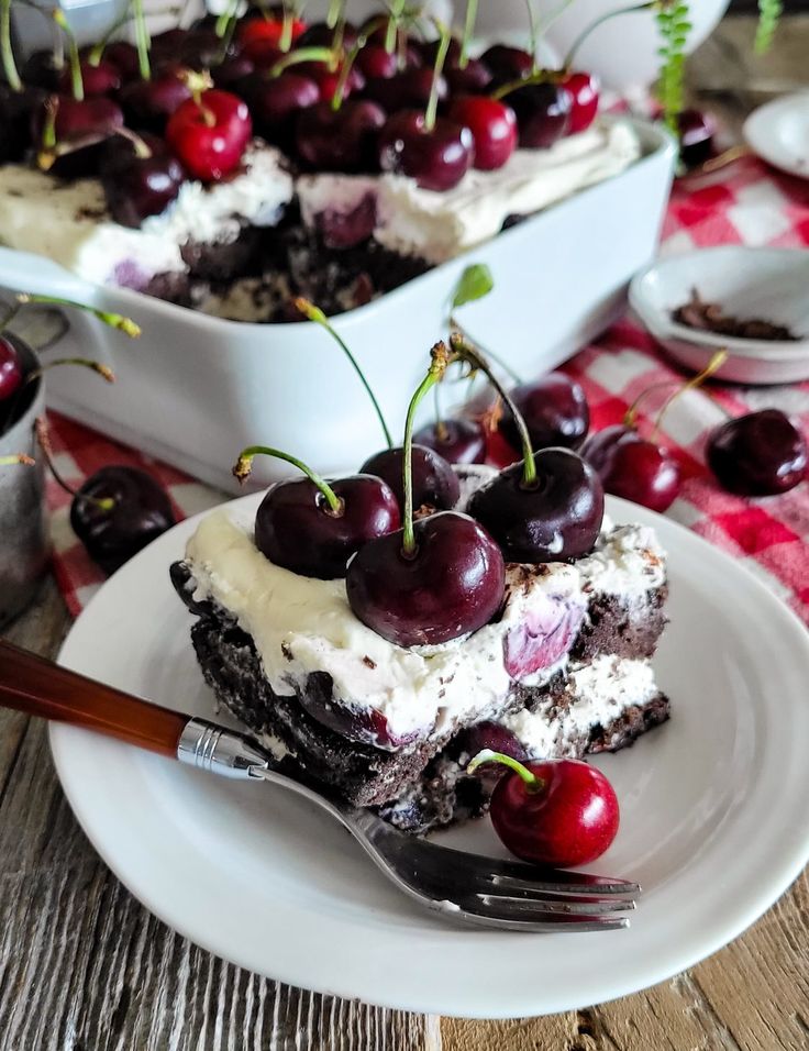 A layered Black Forest Tiramisu is covered with fresh cherries with their stems on.  The dish is sitting on a red checkered cloth with fresh cherries surrounding it. Cherry Amaretto Tiramisu, Black Forest Tiramisu, Cherry Deserts Fresh Cherries, Fruit Tiramisu Recipe, Cake Portions, Bojon Gourmet, Tiramisu Dessert, Cherry Desserts, Tiramisu Recipe