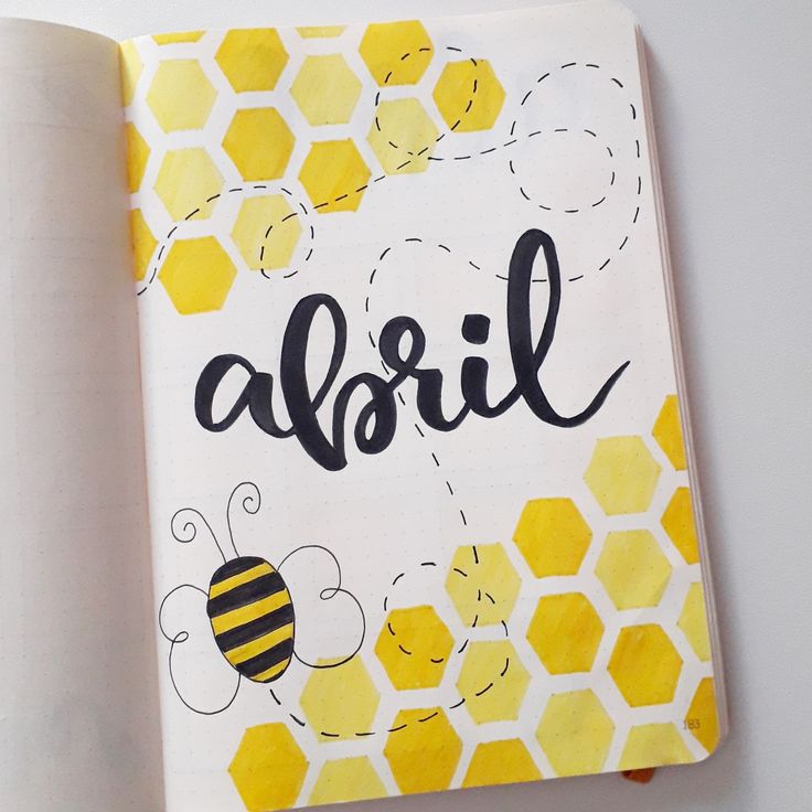 an open notebook with the word abril written on it