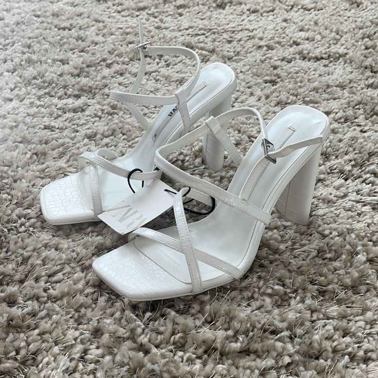 Brand New. White Sandals With 4-inch Heel For Spring, Chic White Heels For Summer, Zara Block Heel Sandals In Synthetic, White Strappy Sandals With Heel Strap, White Strappy Beach Heels, White Strappy Heels For Beach, White Strappy Sandals With Wrapped Heel, White Square Toe Heels For The Beach, White Square Toe Heels For Beach