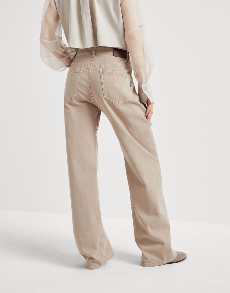 Garment-dyed comfort denim loose trousers with shiny tab Casual styling and refined details characterize these garment-dyed comfort denim Loose pants. Relaxed and slightly loose, straight lines pair perfectly with the soft and versatile appearance of the fabric. A precious monili tag on the back pocket complements the garment with a sparkling, feminine note, in pure Brunello Cucinelli style. Elegant Relaxed Fit Jeans With Pockets, Elegant Wide Leg Relaxed Fit Jeans, Five-pocket Jeans For Fall, Solid Color Jeans With Five Pockets For Fall, Elegant Straight Leg Jeans With Pockets, Fall Jeans With Five Pockets, Solid Color Tapered Leg Jeans With Five Pockets, Five Pocket Tapered Leg Jeans, Classic Beige Wide Leg Jeans