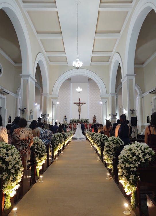 a church filled with lots of white flowers