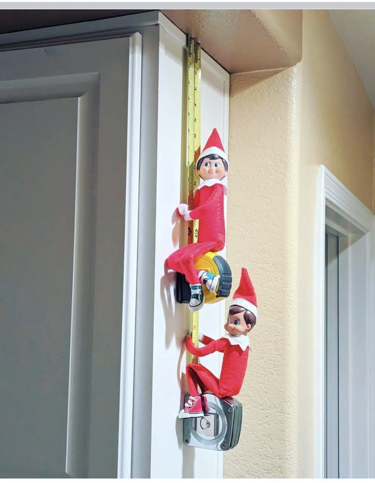 the elf is hanging on the door handle