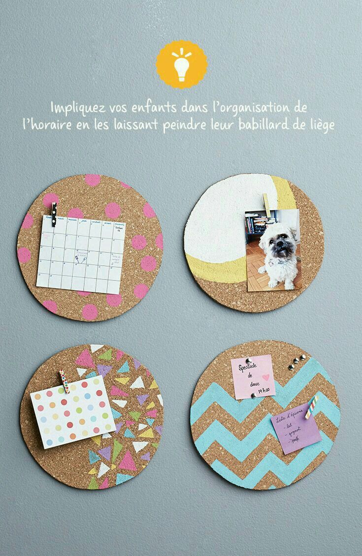 three cork coasters with pictures and magnets attached to them on a gray wall