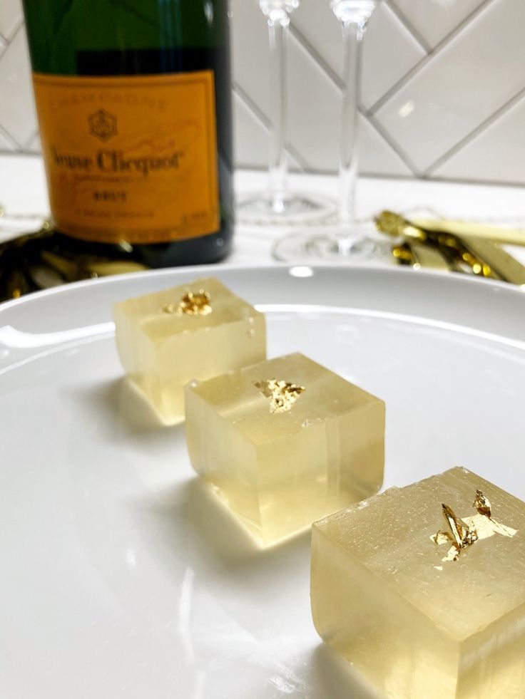 champagne jello - o shots for nye with edible gold leaf ice cubes