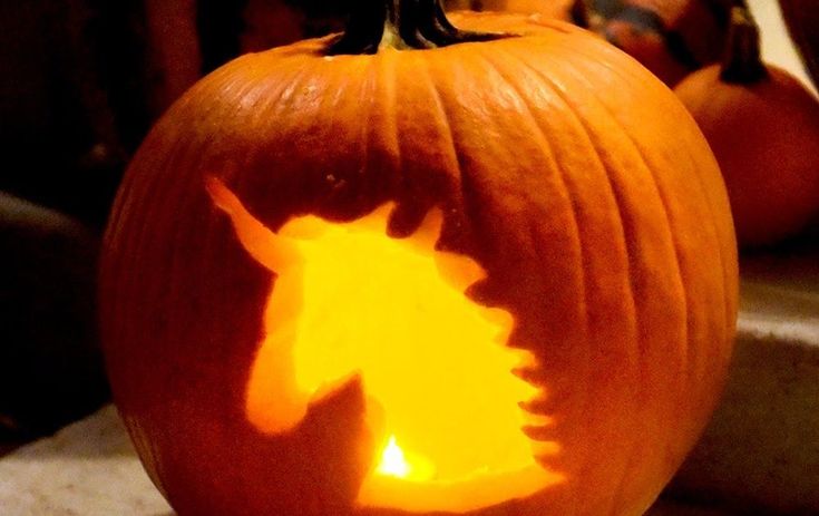 a pumpkin carved to look like a unicorn