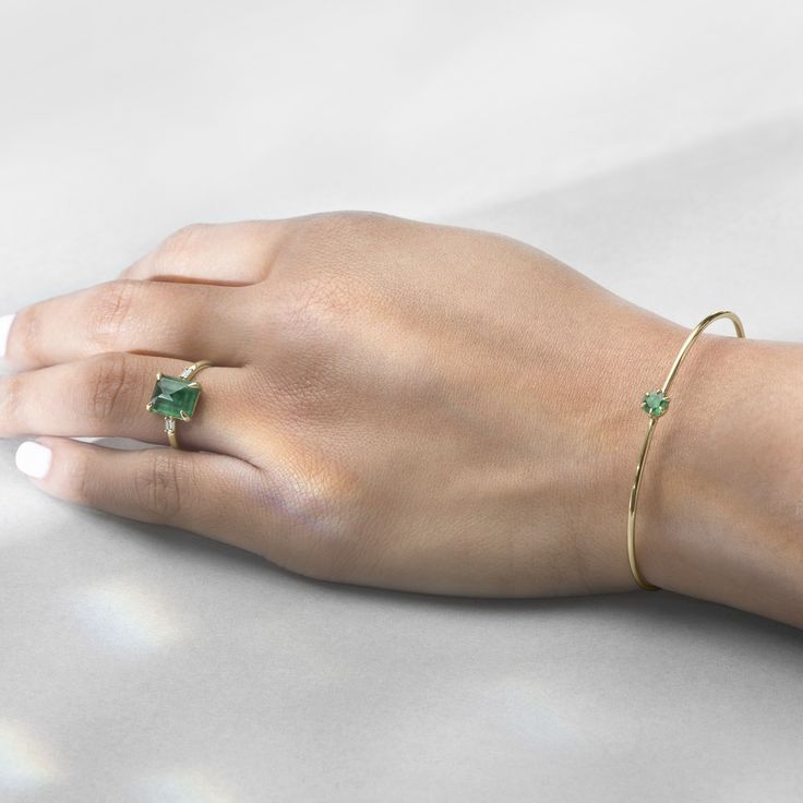 Never over the top, but the perfect amount of design and statement.   . #ILA #emeralds #emeraldring #bangle #gold #sustainable #handcrafted #jewelry #jeweler Modern Emerald Cut May Birthstone Jewelry, Timeless Green Jewelry With Baguette Diamonds, Si Clarity Emerald Cut Jewelry For Anniversary, Anniversary Jewelry With Si Clarity And Emerald Cut, Modern Green Jewelry With Prong Setting, Minimalist Emerald Jewelry For Formal Occasions, 14k Gold Emerald Cut Emerald Ring For Everyday, Fine Jewelry With Baguette Emerald Cut Diamonds, Fine Jewelry With Baguette Diamonds And Emerald