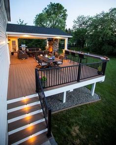 an outdoor deck with lights on it