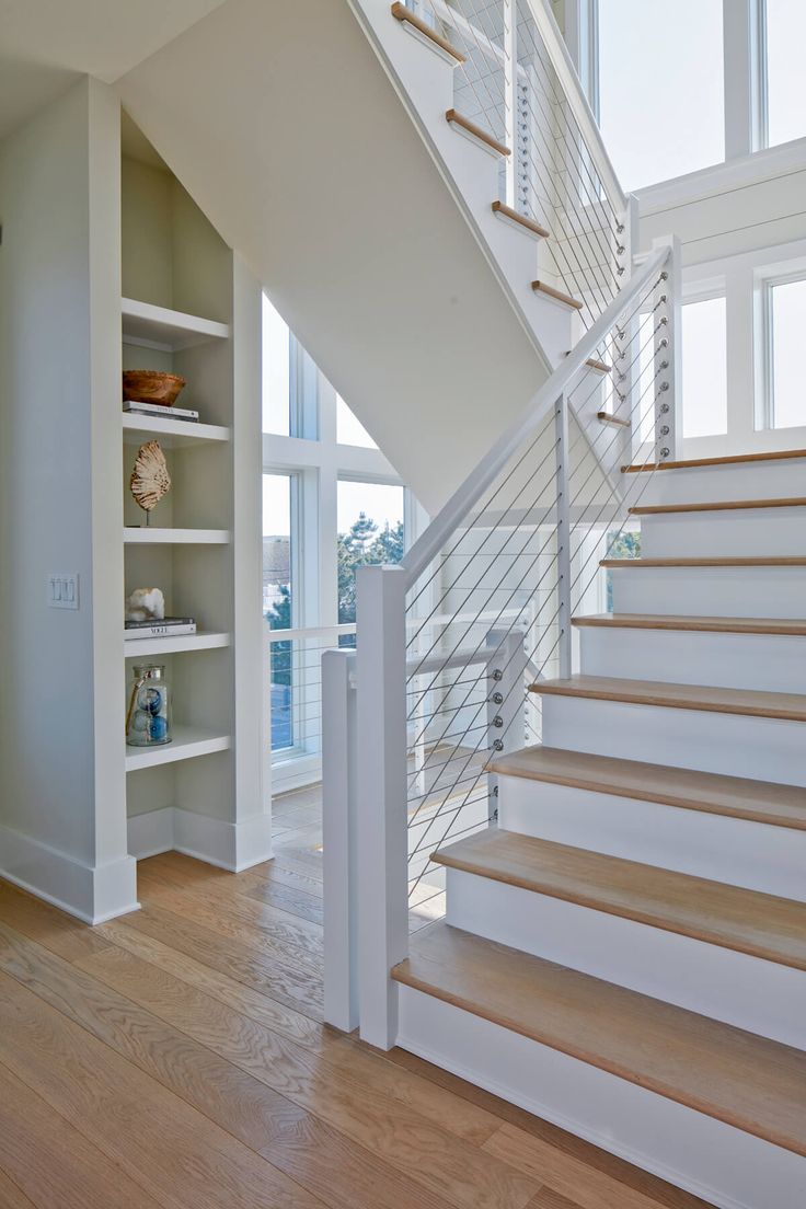 there is a white stair case in the house