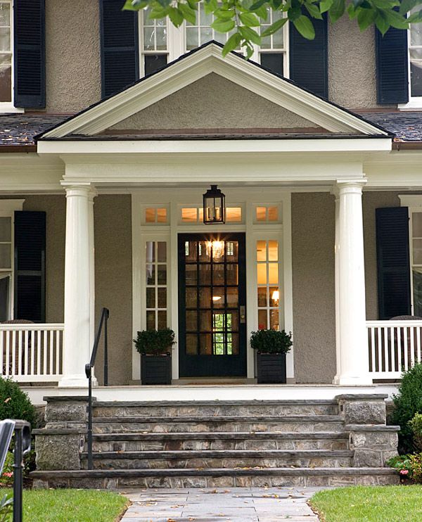 the front porch of a house with steps leading up to it