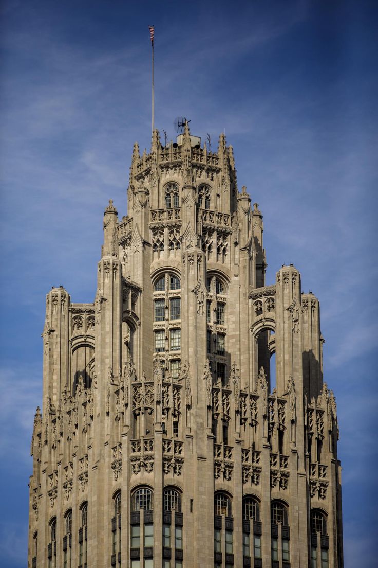 the top of a tall building with many windows