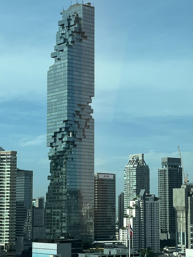 a very tall building with lots of windows in the middle of it's side