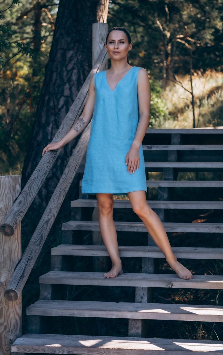 An easy-breezy shift dress for carefree essence. Made of pure linen, Maya mini dress features loose and sleeveless shape with a plunging V-neckline at the front and back. Depending on your plans, wear it with strappy sandals or sneakers. About the collection Either you are reading travel books in the garden, taking a walk in the nearby meadow or exploring foreign islands, we want you to feel beautiful in all corners of the Earth. Our Summer Wanderlust collection is designed with a free-spirited, Summer V-neck Unlined Linen Dress, Unlined V-neck Sleeveless Dress, Blue Linen Mini Dress For Vacation, Summer Linen V-neck Dress, Spring V-neck Sleeveless Unlined Dress, Linen V-neck Mini Dress For Vacation, Blue V-neck Linen Dress For Vacation, Blue Linen V-neck Dress For Vacation, Blue V-neck Summer Dress For Daywear