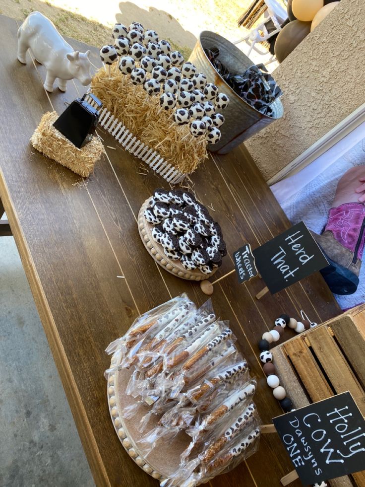 various pastries are displayed on a wooden table