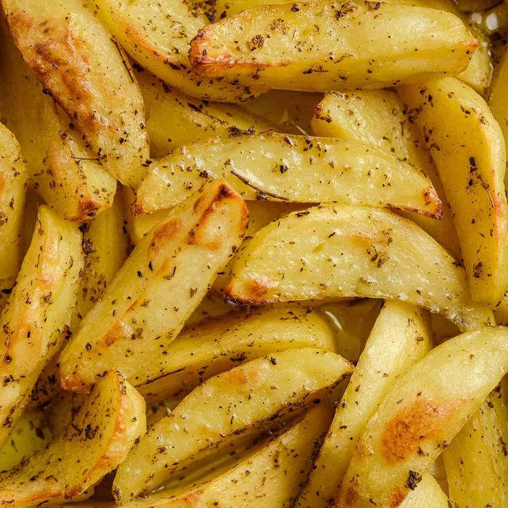 seasoned potatoes with seasoning in a pan