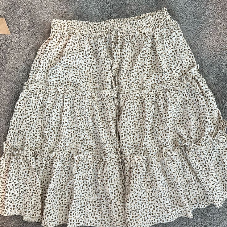 Floral Skirt. Goes Past The Knee. Never Worn Cream Skirted Bottoms For Spring, Cream Maxi Skirt For Spring Day Out, Spring Beige Tiered Skirt, Beige Tiered Skirt For Spring, Cream Maxi Skirt With Lined Skirt For Day Out, Cream Lined Maxi Skirt For Day Out, Chic Cream Skirt For Vacation, Cream Midi Skirt For Day Out, Beige Tiered Skirt For Brunch