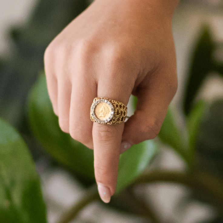 Circa 1970s, this 14 karat yellow gold Coin Ring features 19 single cut diamonds of I1-I2 quality totaling approx. 0.475cttw. Available in a size 6.5. Gold Coin-shaped Ring For Anniversary, Vintage 14k Gold Coin Ring, Vintage Coin Shaped Signet Ring Gift, Gold Coin-shaped Engraved Signet Ring, Pepper Band, Gold Coin-shaped Signet Ring For Gift, Gold Coin Ring, Bezel Necklace, Coin Ring