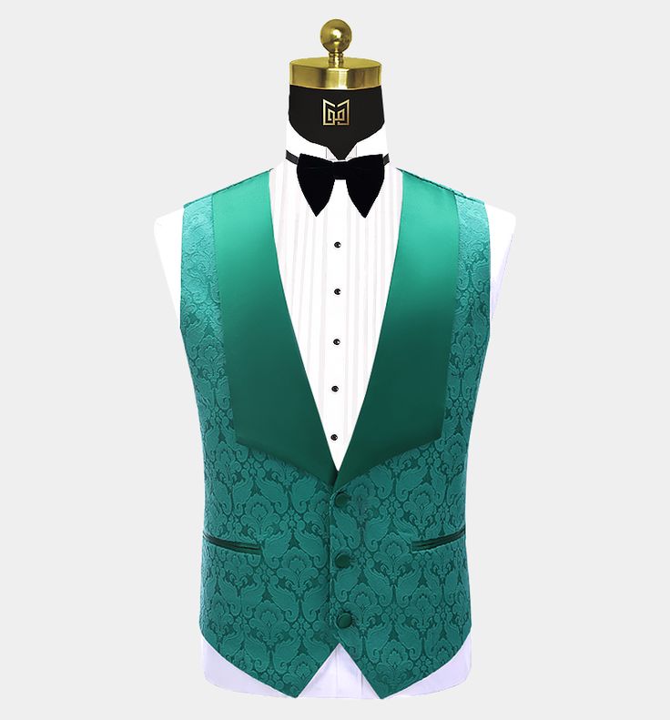 This men's three-piece green damask tuxedo is sure to get you noticed at your next formal affair. This fancy outfit is finely handcrafted from a high-quality material with a delicately textured damask design. This elegant tuxedo set comes with a patterned blazer, a matching vest, and dress pants. The contrasting peak collar, buttons, and pocket piping all provide added class and interest to this set. The lightweight fabric is soft and comfortable as well as stain-resistant. The vest/waistcoat ha Patterned Blazer, Green Tuxedo, Fancy Outfit, Damask Design, Vest Waistcoat, Tuxedo Jacket, Fancy Outfits, Three Piece, Teal Green