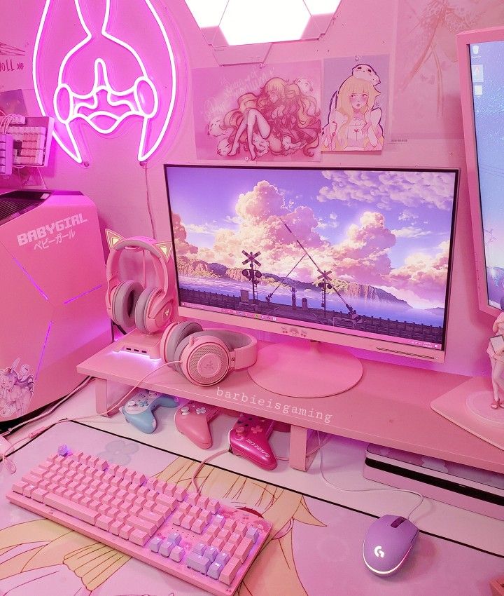 a pink computer desk topped with a monitor and keyboard