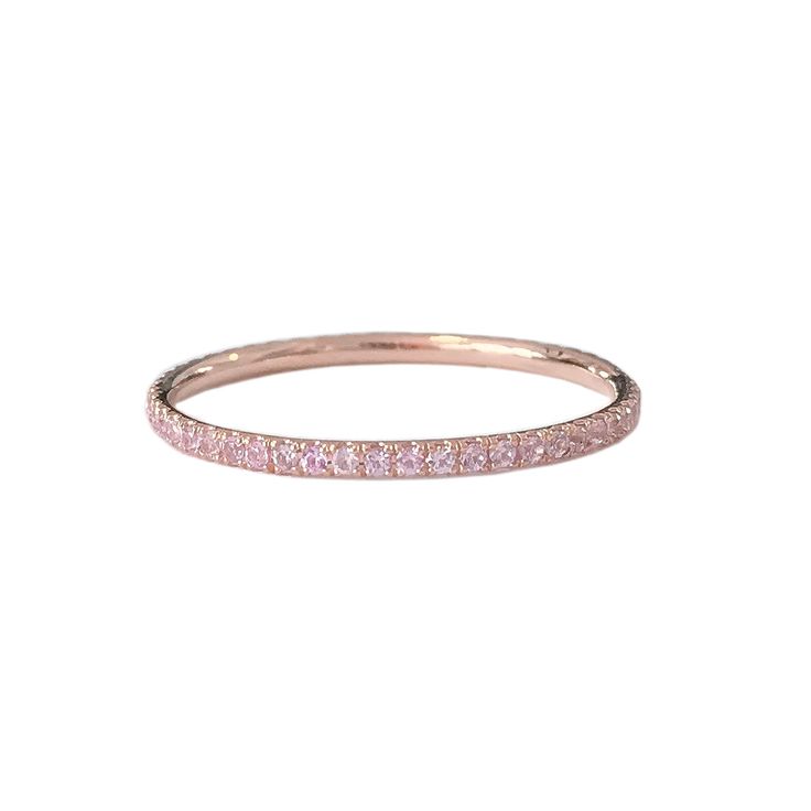 "This finely handcrafted ring is made completely of 14K solid gold and micro pavé set with genuine AAA quality round brilliant cut natural real Powder Pink Sapphire gemstones. Perfect for stacking. ♦ Band Width: approximately 1.3mm ♦ Metal Finish: High Shine Polish ♦ This design is available in Rose, White and Yellow 14K Gold; also in 14K White Gold with Black Rhodium Plated Finish ♦ This item is proudly made in USA. *This piece comes in a Nana Bijou branded white leatherette jewelry gift box, a Pink Sapphire Rings With Pave Setting, Pink Sapphire Ring With Single Cut Diamonds, Luxury Stackable Rings With Pave Setting, Luxury Round Stackable Rings With Pave Setting, Luxury Stackable Round Rings With Pave Setting, Pink Sapphire Pave Setting Ring, Round Pink Sapphire Jewelry With Pave Setting, Fine Jewelry Eternity Band With Pave Setting For Promise, 14k Gold Eternity Band With Pave Setting