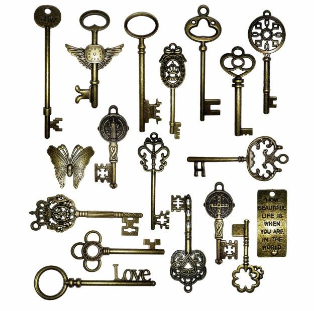 an assortment of antique keys are shown in this image, including one for the door