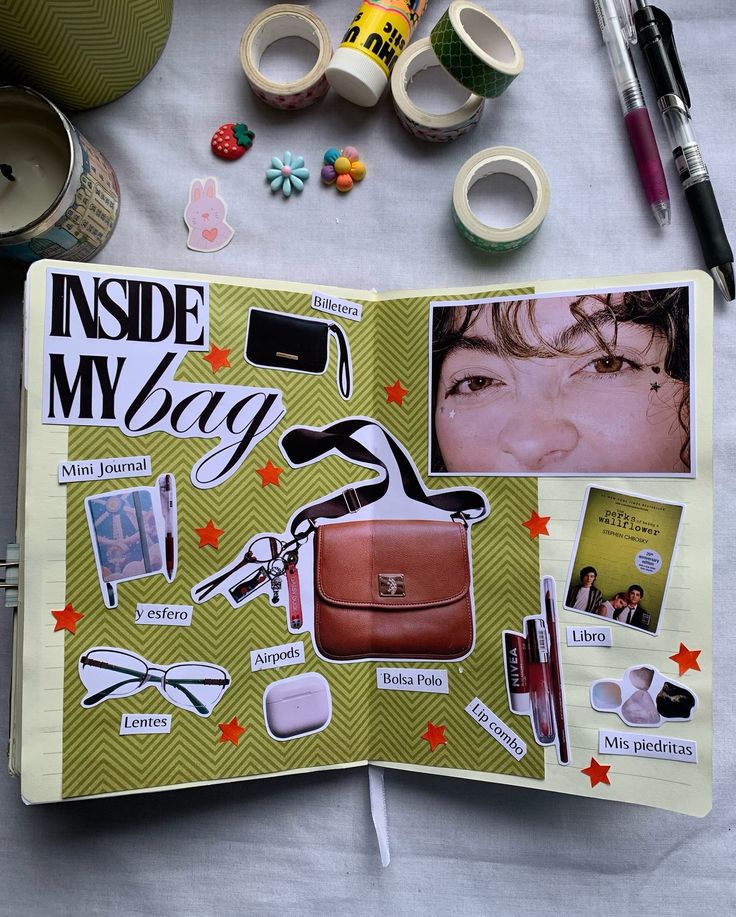 the inside of a book with various items on it and some pens, scissors, markers