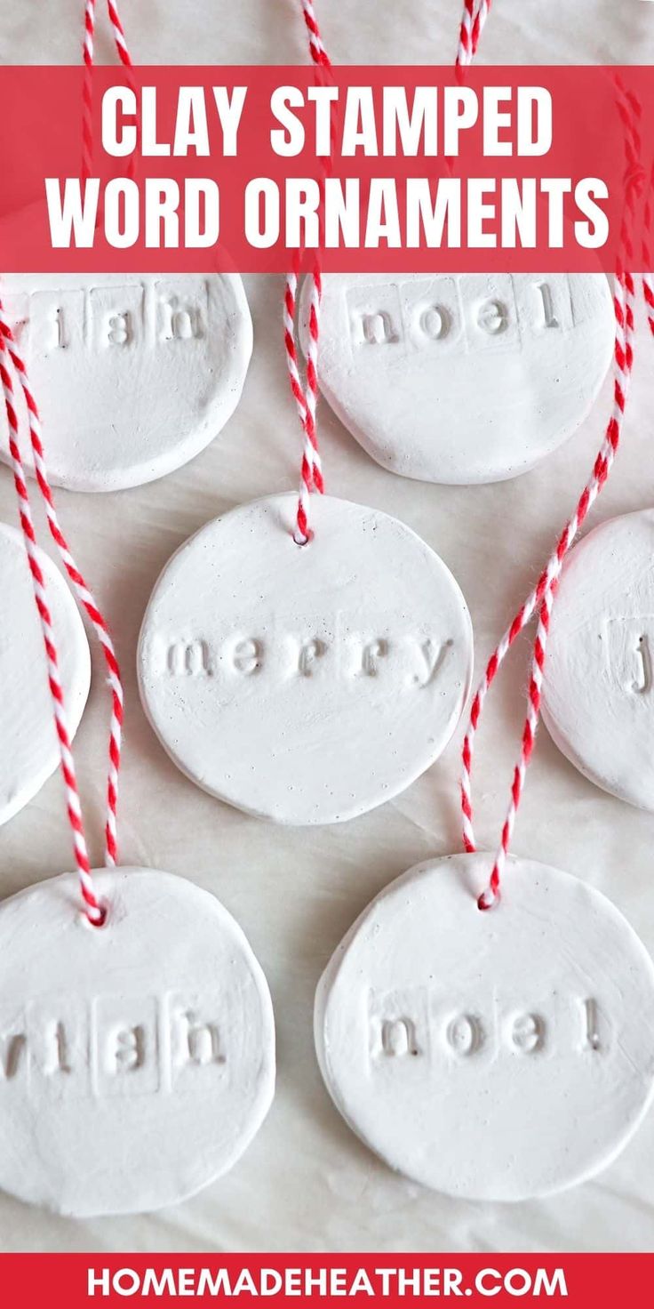 clay stamped word ornaments with red and white striped twine on them, text reads clay stamped word ornaments