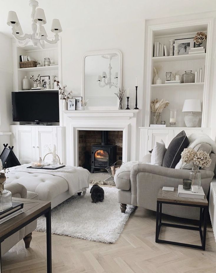 a living room filled with furniture and a fire place