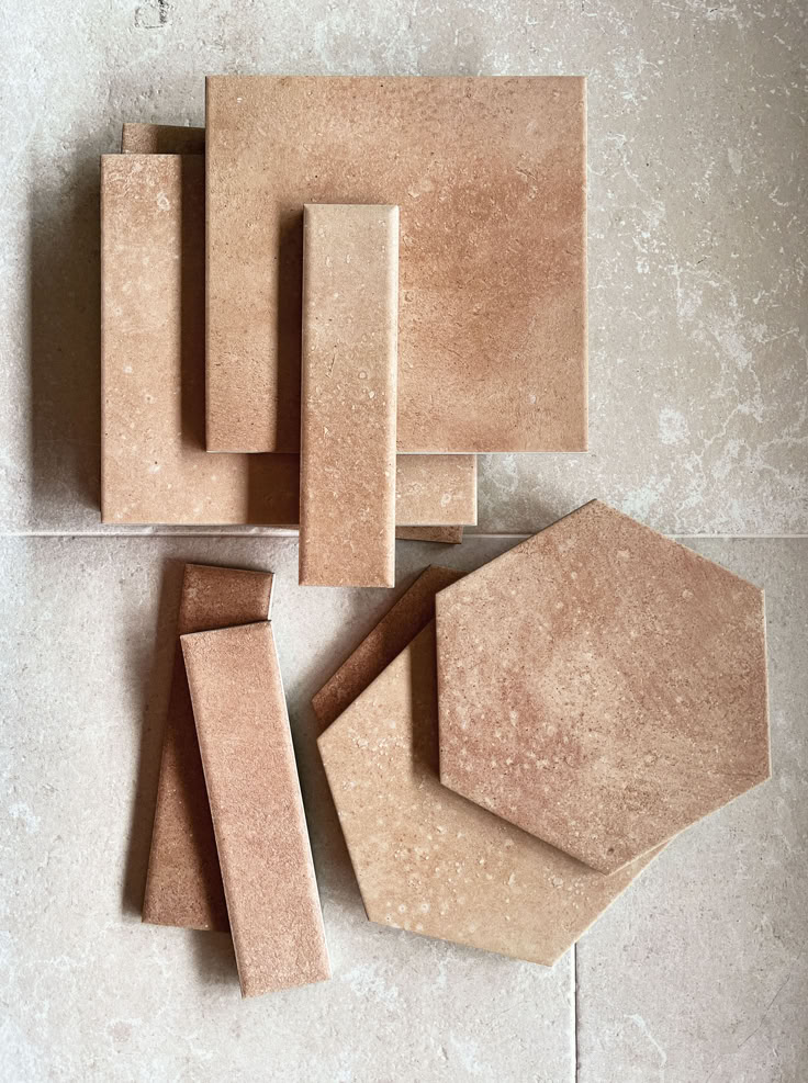 several different shapes and sizes of tiles on the floor