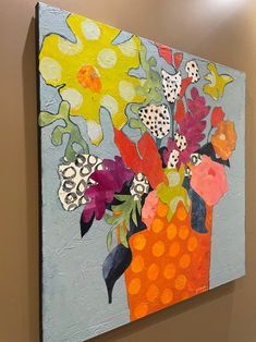 an abstract painting of flowers in a vase on a gray and orange background with polka dots