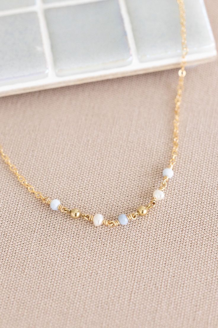 Dainty 14k gold filled small plain chain with (3) 3mm blue opal beads, (2) 3mm round freshwater pearls, and (2) 3mm 14k gold filled beads wire wrapped together to connect Dainty 14k Gold Filled Beaded Chain Jewelry, 14k Gold Filled Jewelry With Gold Beads, Dainty Wire Wrapped Necklaces With Round Beads, Dainty Wire Wrapped Round Bead Necklaces, Delicate 14k Gold Filled Jewelry With Tiny Beads, 14k Gold Filled Jewelry With Tiny Beads, Dainty Wire-wrapped Necklaces With Round Beads, Dainty 14k Gold Filled Jewelry With Gold Beads, Dainty Beaded 14k Gold Filled Jewelry