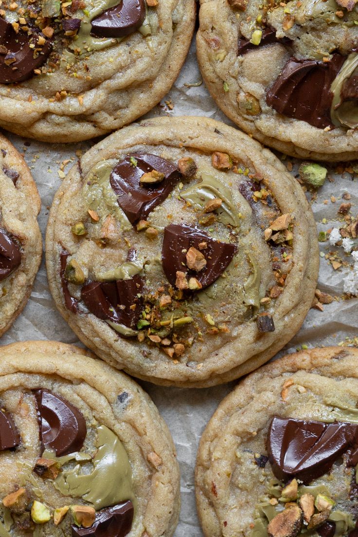 several cookies with chocolate and nuts on top