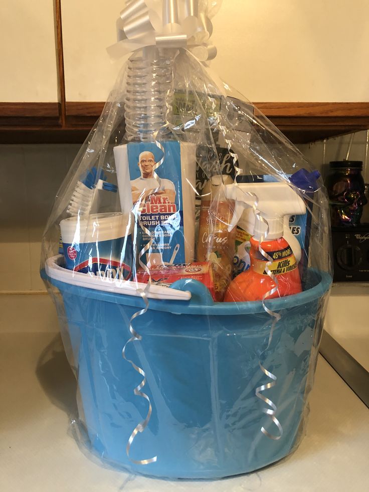 a blue plastic basket filled with personal care items