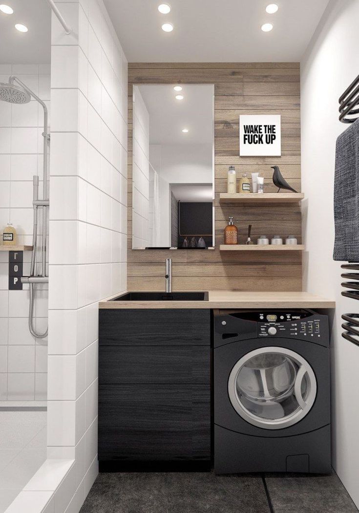 a washer and dryer in a small bathroom