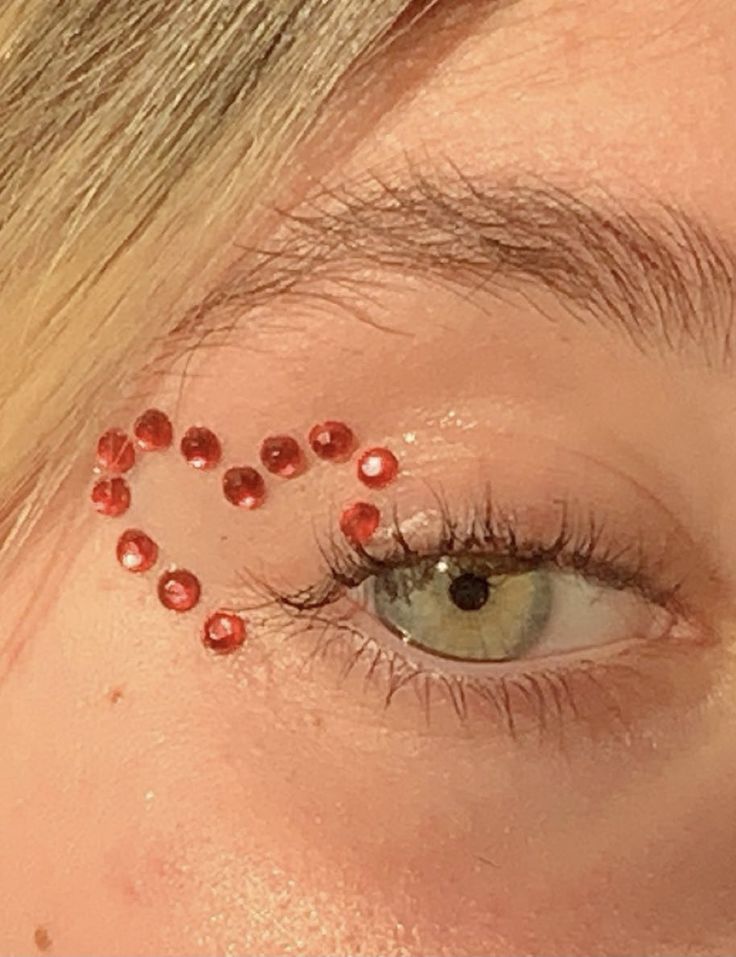 Gem Ideas For Face, Concert Jewel Makeup, Red Gemstone Eye Makeup, Concert Face Jewels, Cute Gem Makeup, Gems Around Eyes, Easy Makeup With Gems, Eras Tour Eye Gems, Easy Rhinestone Eye Makeup