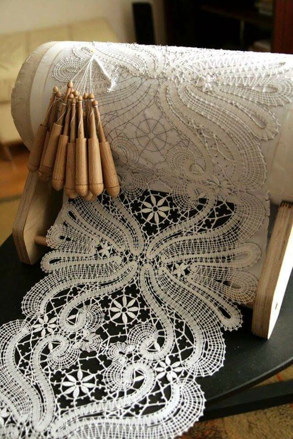 an old roll of lace sitting on top of a table