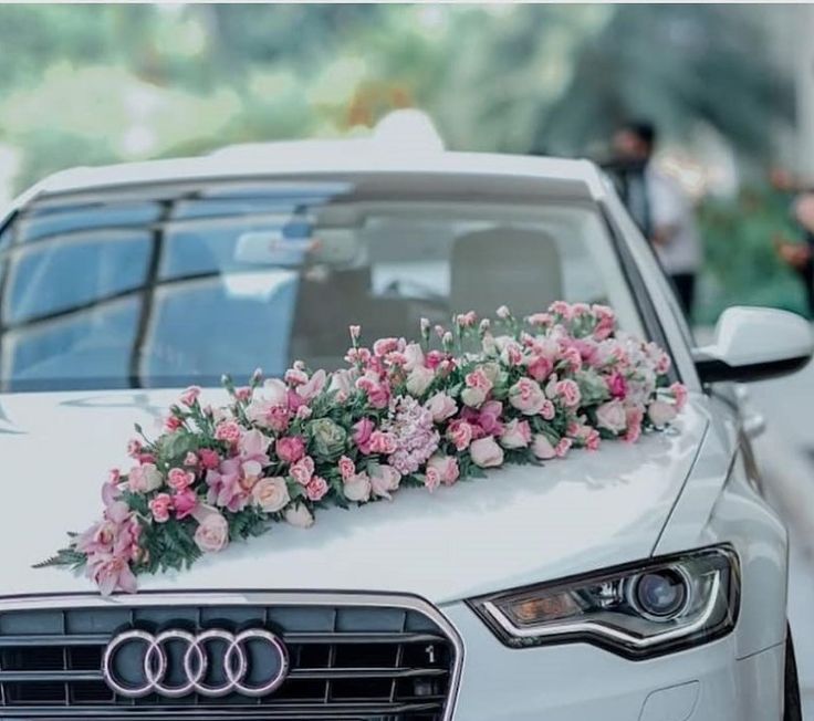 an audi car decorated with flowers and greenery