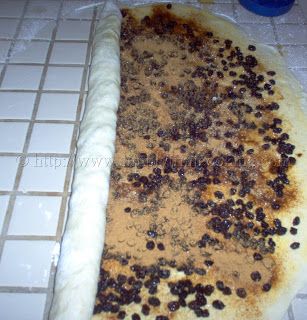 an uncooked pizza sitting on top of a counter