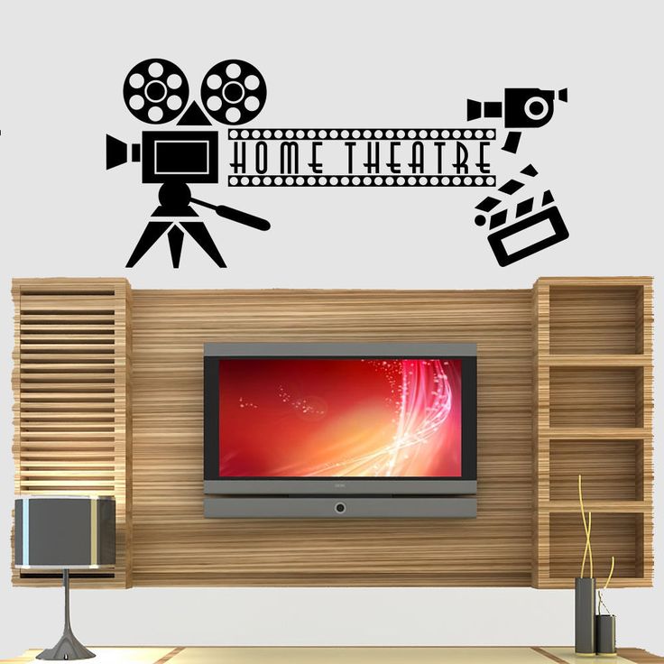 a wall decal that says home theatre with a camera and film reel on it