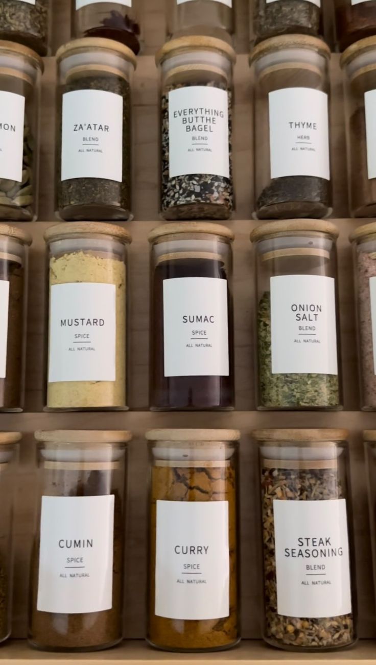 many jars filled with different types of spices