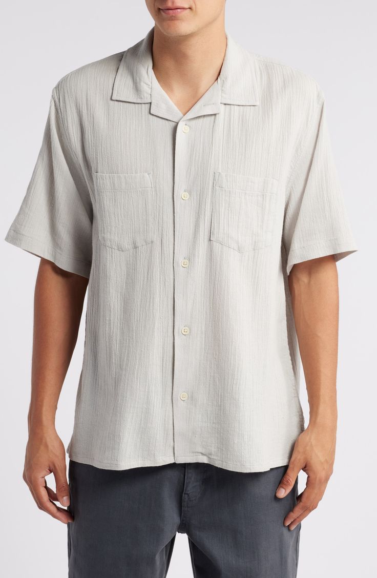 Rumpled and puckered like a well-loved favorite, this camp shirt made of soft cotton features a relaxed fit that's perfect for enjoying warm, sunny days. 29" length (size medium) Front button closure Notched collar Short sleeves Chest patch pockets 100% cotton Machine wash, line dry Imported Classic Short Sleeve Shirt With Camp Collar For Beach, Classic Short Sleeve Camp Collar Shirt For Beach, Classic Camp Collar Short Sleeve Shirt For Beach, Classic Beach Shirt With Camp Collar, Classic Camp Collar Shirt For Beach, Classic Camp Collar Tops For Beach, Classic Beach Tops With Camp Collar, Classic Relaxed Fit Short Sleeve Shirt For Vacation, Classic Short Sleeve Shirt With Relaxed Fit For Vacation