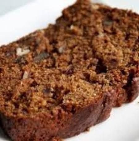 a close up of a piece of cake on a plate with the words date cake recipe above it