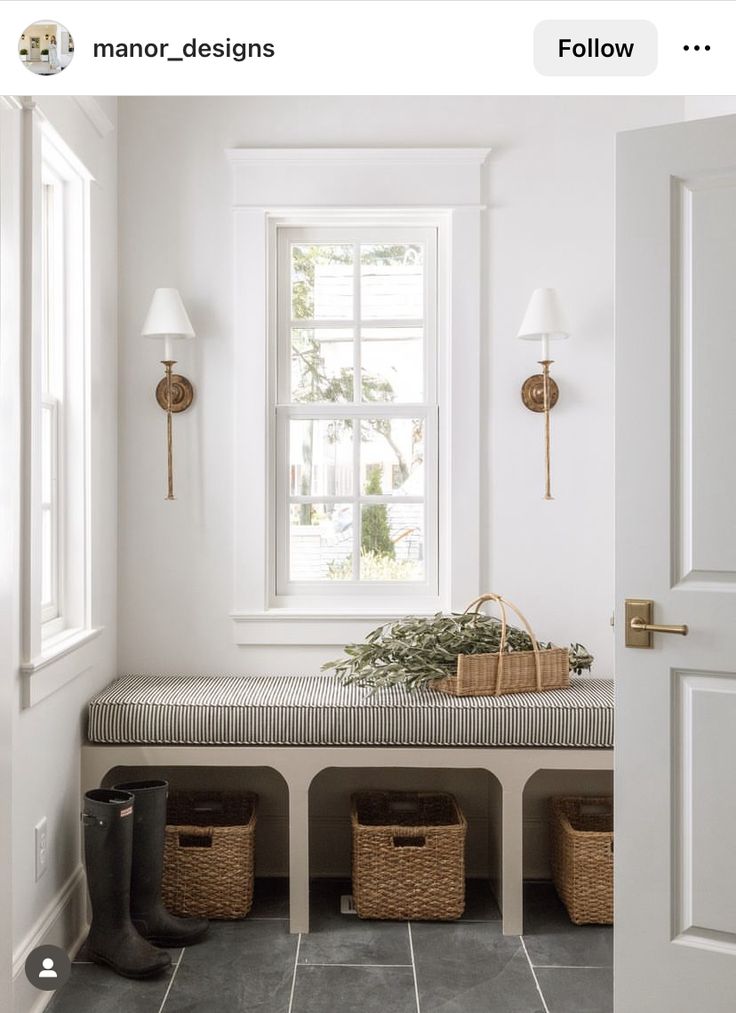 a white room with some baskets on the bench